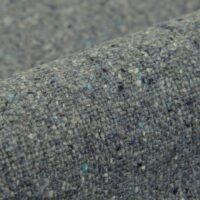 Borana wool-blend upholstery fabric, colour 15: 50% wool / 40% polyacrylic / 10% polyester Uni boucle weave with a Scandinavian natural-fibre look, 140 cm wide, 520 g/m², 50 000 Martindale rubs class SC, light fastness 5 — for sofas, lounge chairs and considered residential interiors.