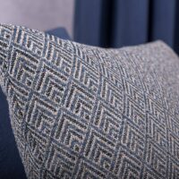 Calace FR flame-retardant upholstery fabric shown in an interior setting — Dessin-weave 100% polyester cloth with a 4.5 × 3.5 cm texture, BS 5852 CRIB 5 certified, suitable for hotel, restaurant and contract upholstery. Lifestyle view 1.