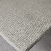 Cassia FR upholstery fabric in interior — recycled olefin / polyester / PAN blend, boucle texture, UV-stable. Lifestyle view 7.