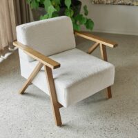 Cenia FR patterned upholstery fabric in interior — polyester / acrylic / viscose blend, large pattern repeat. Lifestyle view 1.
