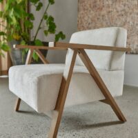 Cenia FR patterned upholstery fabric in interior — polyester / acrylic / viscose blend, large pattern repeat. Lifestyle view 2.