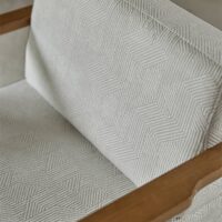Cenia FR patterned upholstery fabric in interior — polyester / acrylic / viscose blend, large pattern repeat. Lifestyle view 4.