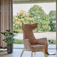 Dolomite FR recycled-content FR upholstery fabric in interior — soft suede-like surface, 100 000 Martindale. Lifestyle view 1.