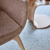 Dolomite FR recycled-content FR upholstery fabric in interior — soft suede-like surface, 100 000 Martindale. Lifestyle view 4.