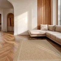 Grano Frame Amber outdoor rug on a sunlit terrace