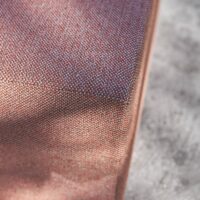 Marfil upholstery fabric in interior — 100% recycled olefin Uni, UV-stable, stain-resistant. Lifestyle view 2.
