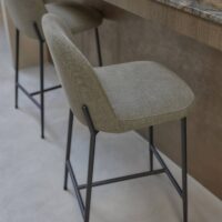 Sumac FR natural-look FR upholstery fabric in interior — PAN / recycled polyester / viscose / linen blend with linen-touch hand. Lifestyle view 1.