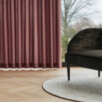 Triana FR striped upholstery fabric in interior — 100% polyester FR, 100 000 Martindale stripes. Lifestyle view 2.